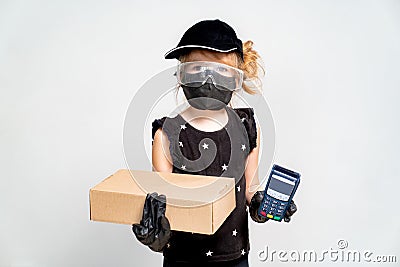 Contactless payment. Little girl is delivery man. Stock Photo