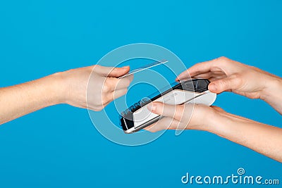 Contactless payment with credit card on blue Stock Photo