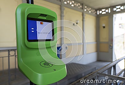 Contactless ticket validator for public transport. Purchase of the ticket by credit card or mobile phone. Pay and go Editorial Stock Photo