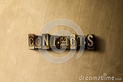 CONTACTS - close-up of grungy vintage typeset word on metal backdrop Stock Photo