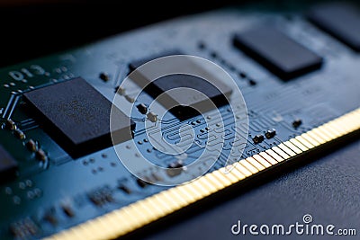 Contacts, connecting tracks and microchips of a computer RAM Random Access Memory modules close-up for electronic design. Stock Photo