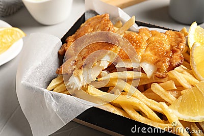 Container with British traditional fish and potato chips Stock Photo