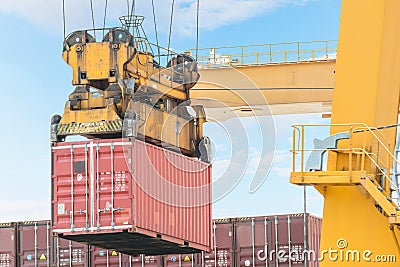 Container Cargo freight ship with working crane loading bridge i Stock Photo