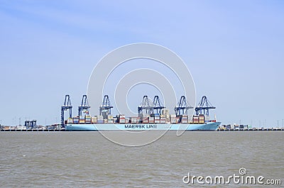 A container ship being unloaded. Editorial Stock Photo