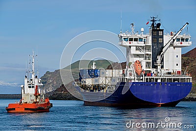 Container Ship departs Heimaey port in Westman Islands Editorial Stock Photo