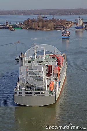 Container ship near a floodgate Stock Photo