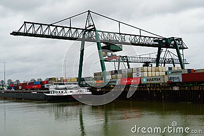 container ship loaded in the Niehler Hafen in Cologne Editorial Stock Photo
