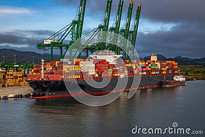 Container ship loading and unloading in Colon Container Terminal Editorial Stock Photo