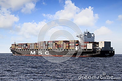 Big container ship of MSC Company sailing in open waters. Editorial Stock Photo