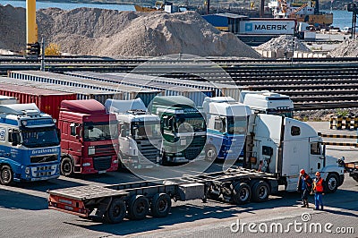 Container trailers parked in row on cargo port berth Editorial Stock Photo