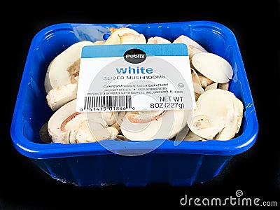 Container of White Sliced Mushrooms on a Black Backdrop Editorial Stock Photo