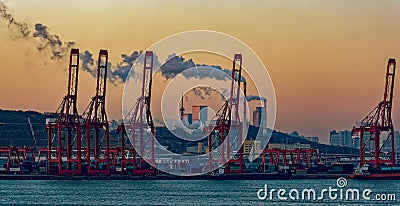 Containers loading by crane with sunrise. Stock Photo