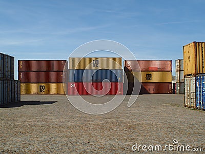 Containers stacked on a harbor wait to be shipped worldwide at port Editorial Stock Photo