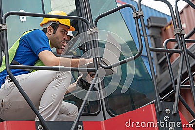 Containers yard management supervisor with container forklift driver in coversation for manage containers yard arrangement at Stock Photo