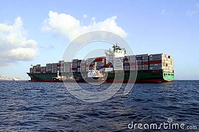 Containership AS MAGNOLIA abroaded to a tanker vessel. Editorial Stock Photo