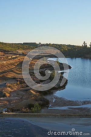 Contaminated pond lake of an old abandoned mine red landscape in Mina de Sao Domingos, Portugal Stock Photo