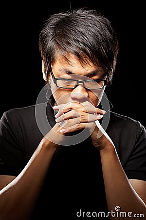 Contemplate Asian man Stock Photo