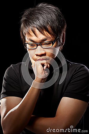 Contemplate Asian man Stock Photo