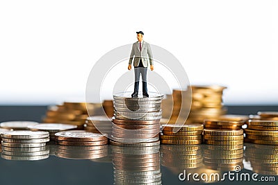 Contemplating Wealth a Miniature Man Reflecting While Seated on Currency Piles, Business Concept. created with Generative AI Stock Photo