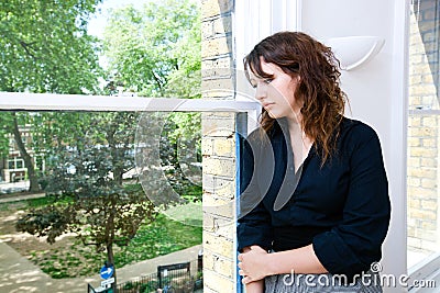 Contemplative businesswoman looking out the window Stock Photo