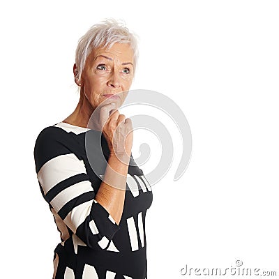 Contemplative older woman looking up Stock Photo