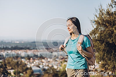 Contemplative young woman looking at the horizon from the hill. Self-confidence. Copy space Stock Photo