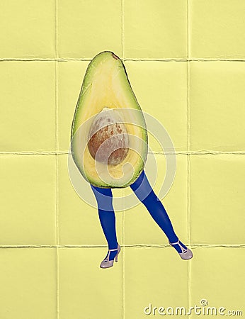 Contemporary art collage. Legs in bright blue tights with healthy avocado head over yellow background. Healthy eating Stock Photo
