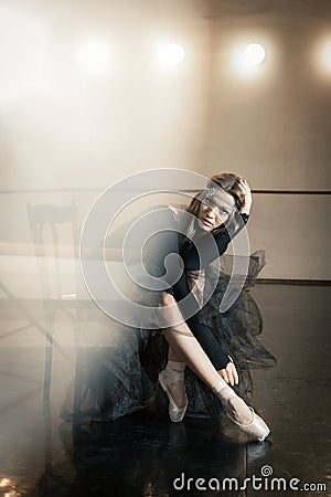 Contemporary ballet dancer on a wooden chair on a repetition Stock Photo