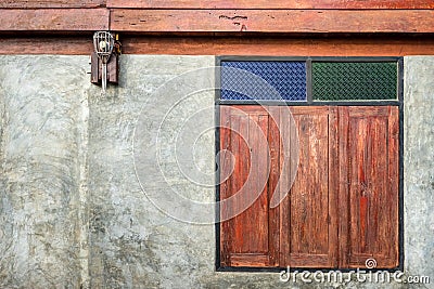 Contemporary bare concrete wall and old wood window Stock Photo