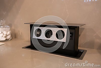 Contemporary build-in socket builded in table - close up photo with selective focus Stock Photo