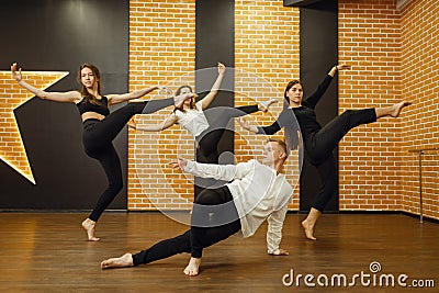 Contemporary dance performers posing in studio Stock Photo