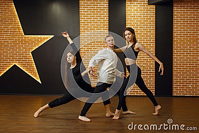 Contemporary dance performers posing in studio Stock Photo