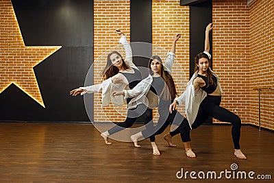 Contemporary dance performers posing in studio Stock Photo