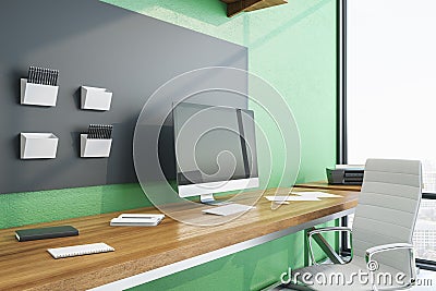 Contemporary green workplace with Ñomputer on table Stock Photo