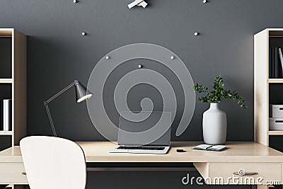 Contemporary manager workspace with filing cabinet, laptop with blank screen Stock Photo