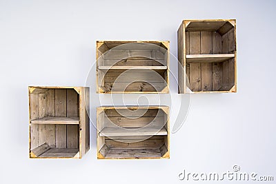 Contemporary shelves made of wooden vegetable boxes Stock Photo