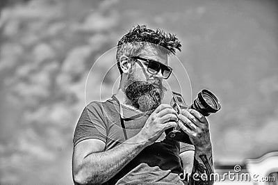 Content creator. Man bearded hipster photographer. Man shooting photos. Old but still good. Manual settings Stock Photo