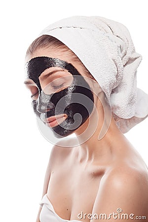 Content woman with cleansing mask on face Stock Photo