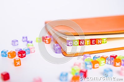 CONTENT word on colorful bead block as bookmark in book. content marketing idea concept Stock Photo