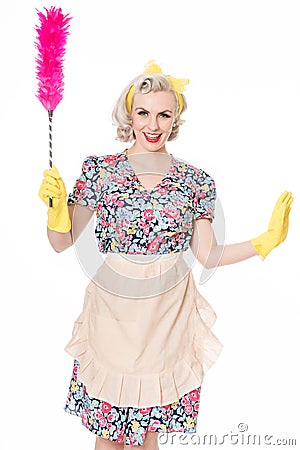 Contented retro housewife, with feather duster, isolated on white Stock Photo