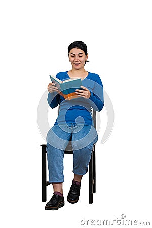 Contented woman student seated on a chair enjoying reading her favorite book isolated over white background Stock Photo
