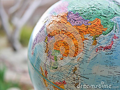 Continent of Asia focus macro shot on globe map for travel blogs, social media, website banners and backgrounds. Stock Photo