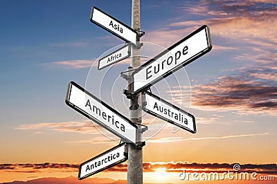 Continents on road direction signpost, with sunset sky background Stock Photo