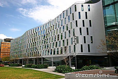 Continuous and undulating gray facade of Vicki Sara Building with array of rectangular windows at University Technology Sydney UTS Editorial Stock Photo