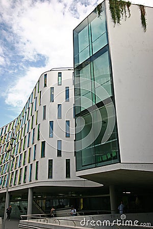 Continued and wavy gray facade of Vicki Sara Building with array of rectangular colorful windows, University Technology Sydney UTS Editorial Stock Photo