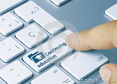 Continuing education - Inscription on Blue Keyboard Key Stock Photo