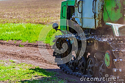 Continuous caterpillar tracks of the bulldozer. Close up detail of a metall crawler tractor tracks Stock Photo