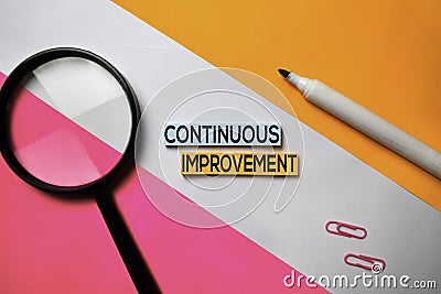 Continuous Improvement text on sticky notes with color office desk concept Stock Photo