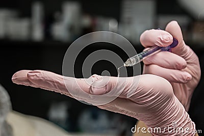 Contour plastic. A cosmetologist injects a botulinum toxin to tighten and smooth out wrinkles on the skin of a female face Stock Photo