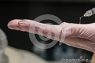 Contour plastic. A cosmetologist injects a botulinum toxin to tighten and smooth out wrinkles on the skin of a female face Stock Photo